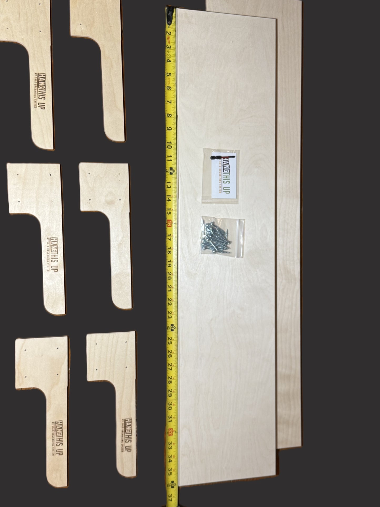 Wooden brackets with a measuring tape for scale on a dark background