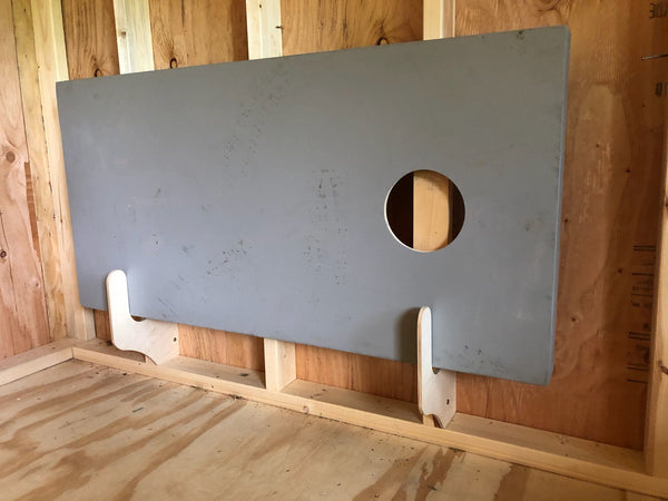A storage rack for corn hole boards in a shed. Efficiently organizes and maximizes yard shed space.