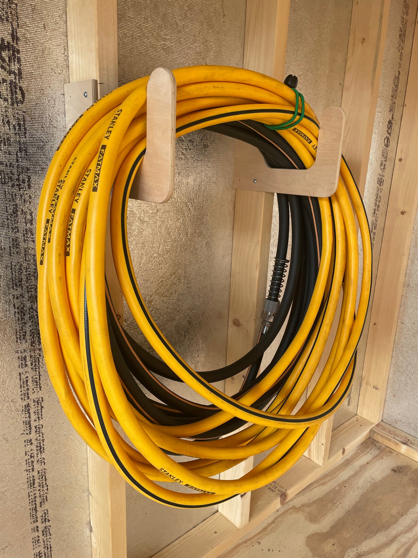 Organizes garden hoses and power washer hoses in your shed space.