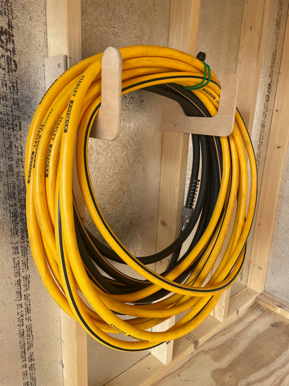 Organizes garden hoses and power washer hoses in your shed space.