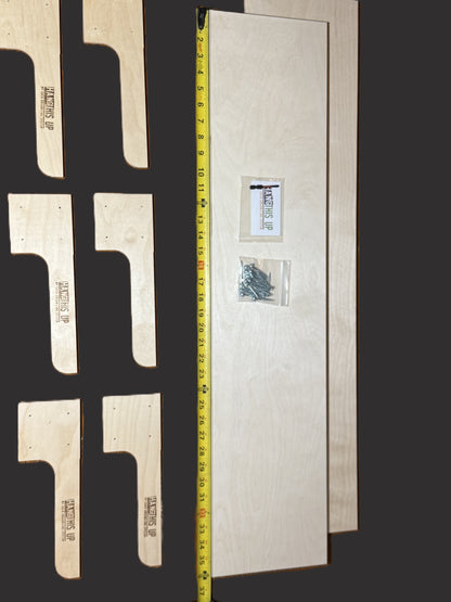 Wooden brackets with a measuring tape for scale on a dark background