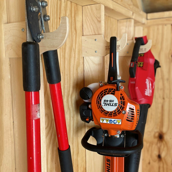 Misc tool rack in wood shed.  Stores power and hand tools.