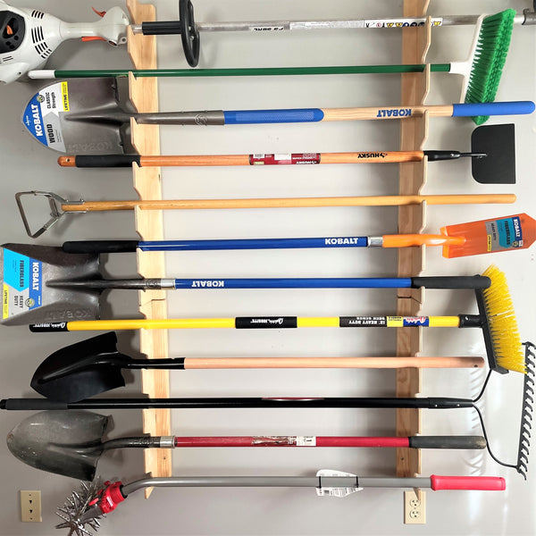 Garden tool rack for garage storage space, providing organized storage for yard tools in the garage.