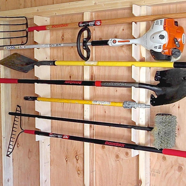 Yard tool rack for shed and garden tool storage, keeping tools organized and easily accessible.