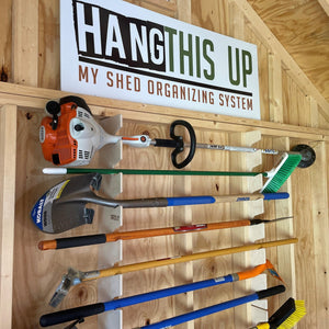 Yard tool rack for shed and garden tool storage, keeping tools organized and easily accessible.