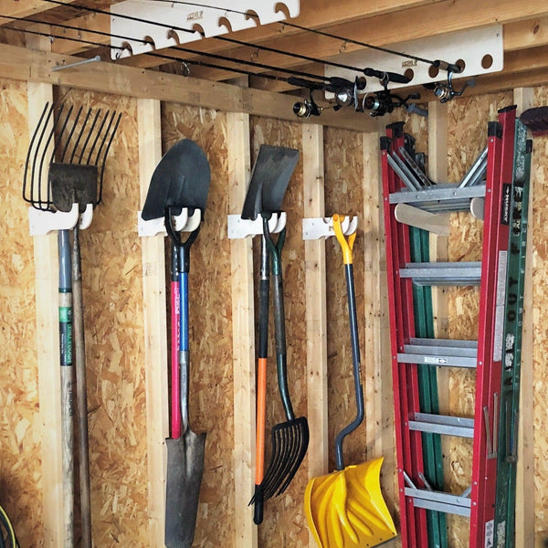 Garden yard tool organizer for shed storage, keeping outdoor tools neatly stored and accessible.