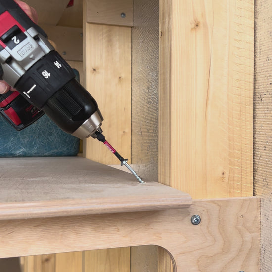 Fastening shelf to stud in a storage shed.