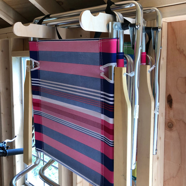 Lawn Chair Bracket with two lawn chairs hanging  in storage shed space.
