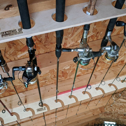 Ceiling mounted Fishing Rod Rack in a wooden shed, storage shed